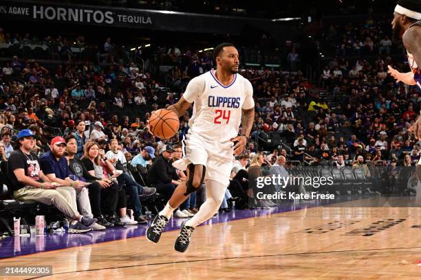 Norman Powell of the LA Clippers handles the ball during the game against the Phoenix Suns on April 9, 2024 at Footprint Center in Phoenix, Arizona....