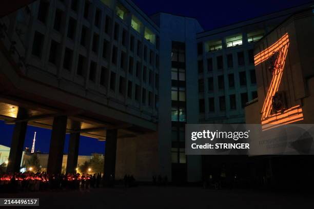 The "Z" letter is seen projected onto the State Council building during a memorial ceremony for Russian service members killed in the ongoing...
