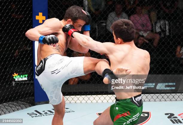 Damon Jackson and Alexander Hernandez exchange strikes in a featherweight fight during the UFC Fight Night event at UFC APEX on April 06, 2024 in Las...