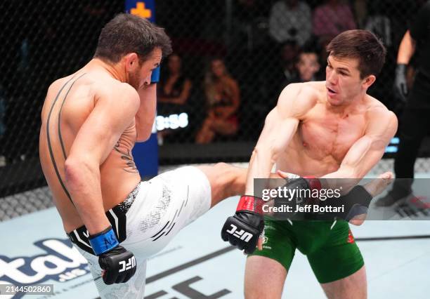 Damon Jackson kicks Alexander Hernandez in a featherweight fight during the UFC Fight Night event at UFC APEX on April 06, 2024 in Las Vegas, Nevada.