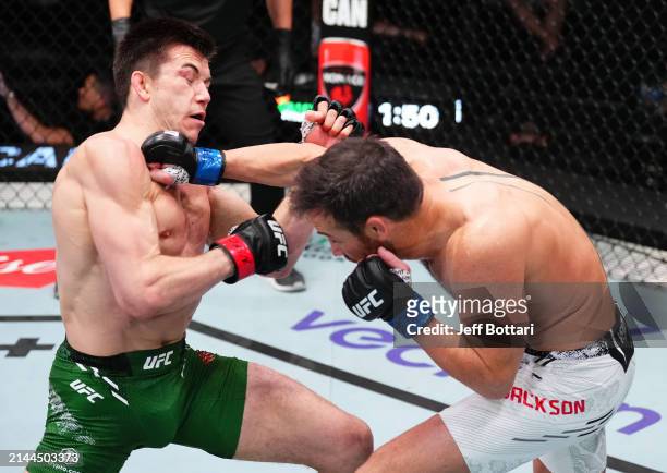 Damon Jackson punches Alexander Hernandez in a featherweight fight during the UFC Fight Night event at UFC APEX on April 06, 2024 in Las Vegas,...