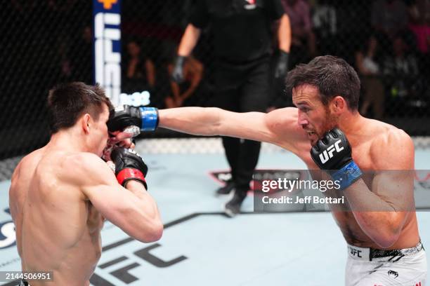 Damon Jackson punches Alexander Hernandez in a featherweight fight during the UFC Fight Night event at UFC APEX on April 06, 2024 in Las Vegas,...