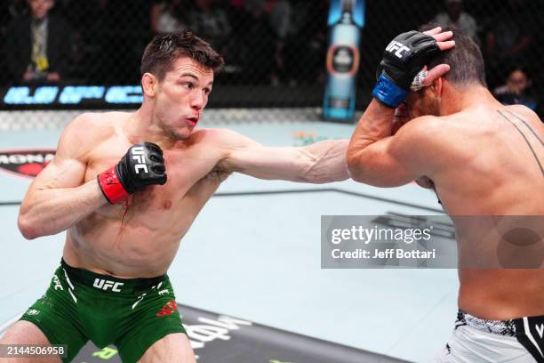 Alexander Hernandez punches Damon Jackson in a featherweight fight during the UFC Fight Night event at UFC APEX on April 06, 2024 in Las Vegas,...