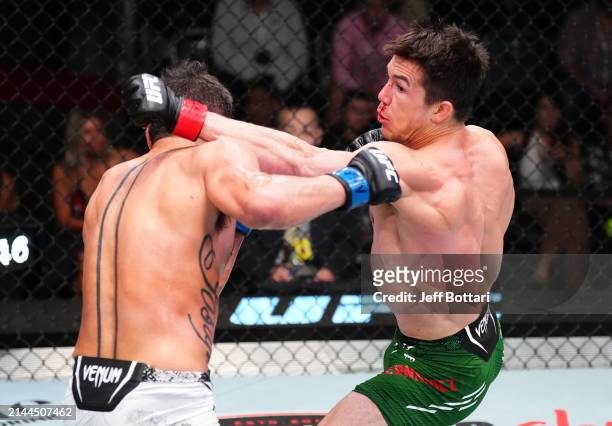 Alexander Hernandez punches Damon Jackson in a featherweight fight during the UFC Fight Night event at UFC APEX on April 06, 2024 in Las Vegas,...