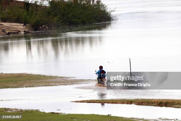 Motorcyclist drives on the Bita river on April 06, 2024 in Puerto Carreño, Colombia. Puerto Carreño is the departmental capital city, and a...