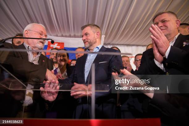 Former president of Slovakia, Ivan Gasparovic, congratulates Peter Pellegrini who won the presidential election on April 7, 2024 in Bratislava,...