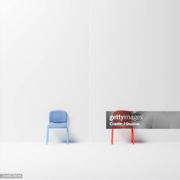 a blue and a red chair separated - white chair isolated stock pictures, royalty-free photos & images