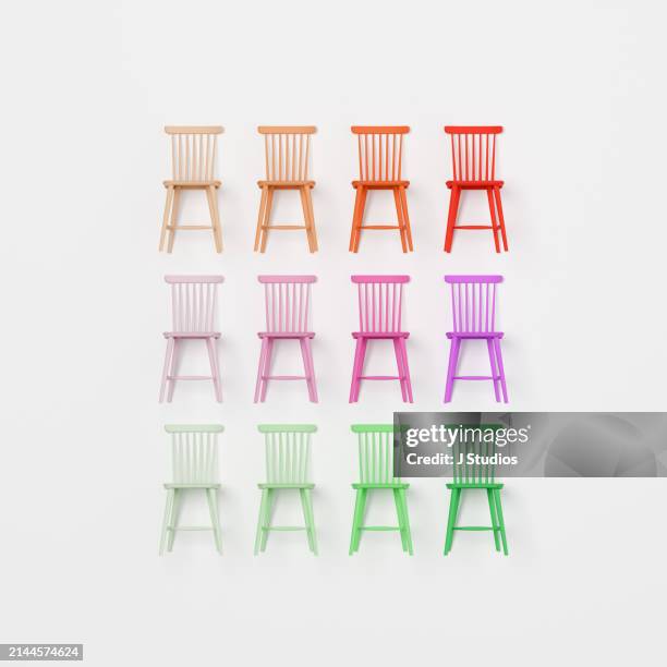 grid pattern of colourful chairs - realismo-concettuale foto e immagini stock