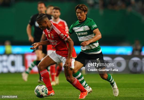 David Neres of SL Benfica with Hidemasa Morita of Sporting CP in action during the Liga Portugal Betclic match between Sporting CP and SL Benfica at...