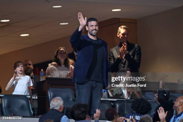 Former Memphis Grizzlies Marc Gasol waves to the crowd during the first half of the game between the Philadelphia 76ers and the Memphis Grizzlies at...