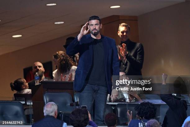 Former Memphis Grizzlies Marc Gasol waves to the crowd during the first half of the game between the Philadelphia 76ers and the Memphis Grizzlies at...