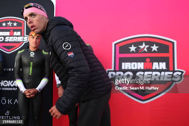 Braden Currie of New Zealand and Sam Long of the United States looks on prior to competing in the 2024 IRONMAN 70.3 Oceanside on April 06, 2024 in...