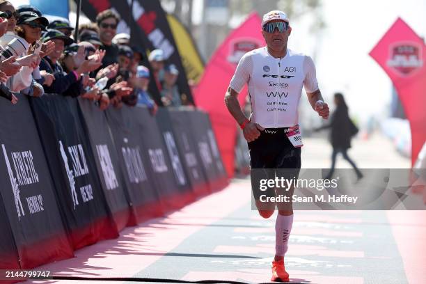 Braden Currie of New Zealand finishes the 2024 IRONMAN 70.3 Oceanside on April 06, 2024 in Oceanside, California.