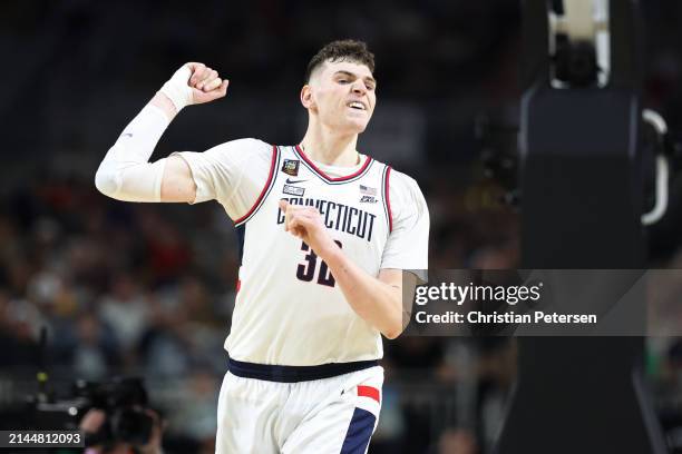 Donovan Clingan of the Connecticut Huskies celebrates in the second half against the Alabama Crimson Tide in the NCAA Men's Basketball Tournament...