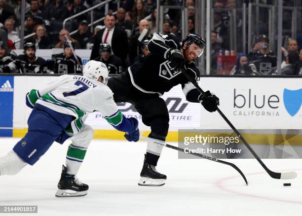 Vladislav Gavrikov of the Los Angeles Kings takes a shot in front of Carson Soucy of the Vancouver Canucks during the second period at Crypto.com...
