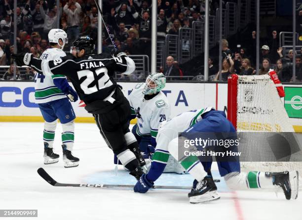 Casey DeSmith, Carson Soucy and Pius Suter of the Vancouver Canucks react to a goal from Kevin Fiala of the Los Angeles Kings, to take a 4-1 lead,...