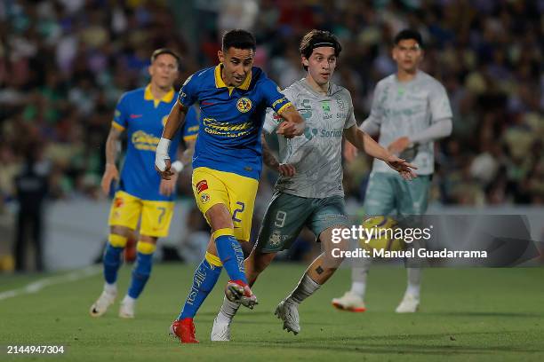 Jordan Carrillo of Santos struggles for the ball with Luis Fuentes of America during the 14th round match between Santos Laguna and America as part...