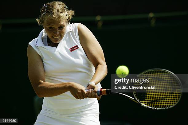 Marie-Gaianeh Mikaelian of Switzerland returns the ball during her match against Jennifer Capriati of the USA during day four of the Wimbledon Lawn...