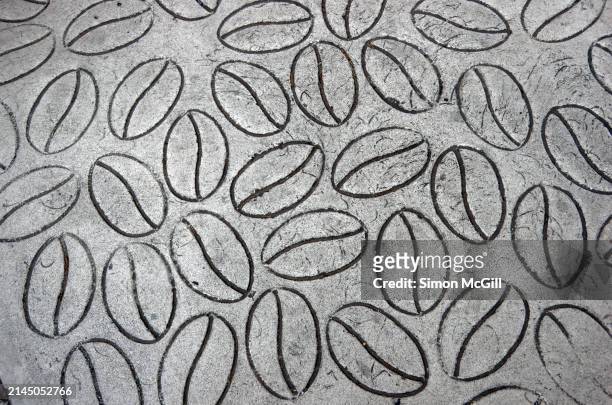 concrete stamped with a coffee bean pattern - stamped concrete stockfoto's en -beelden