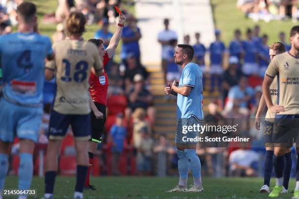 Referee Jack Morgan gives Róbert Mak of Sydney FC a red card during the A-League Men round 23 match between Newcastle Jets and Sydney FC at McDonald...