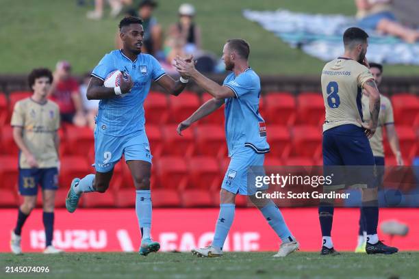 Fabio Gomes of Sydney FC celebrates his goal with Rhyan Grant of Sydney FC during the A-League Men round 23 match between Newcastle Jets and Sydney...