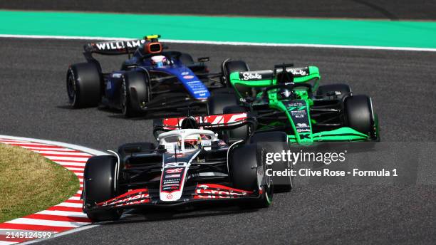 Kevin Magnussen of Denmark driving the Haas F1 VF-24 Ferrari leads Valtteri Bottas of Finland driving the Kick Sauber C44 Ferrari and Logan Sargeant...