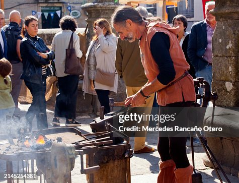 Blacksmith working by fire. Blacksmith working by fire.
