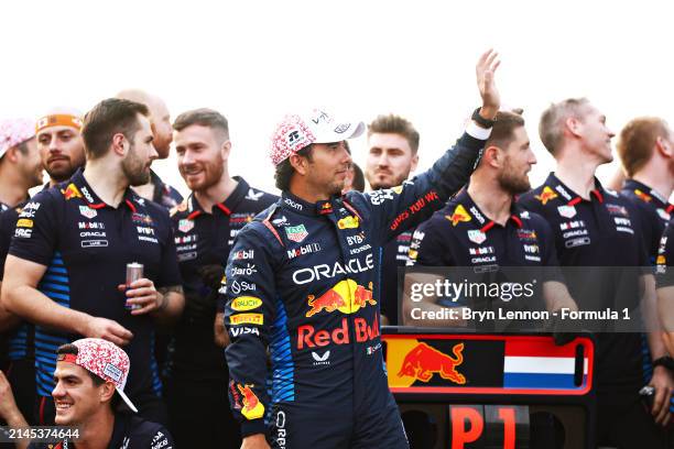 Second placed Sergio Perez of Mexico and Oracle Red Bull Racing celebrates with his team after the F1 Grand Prix of Japan at Suzuka International...