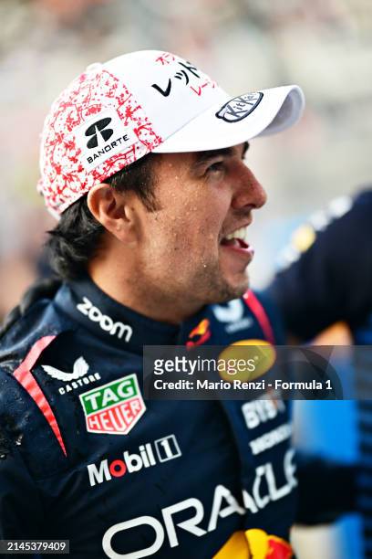 Second placed Sergio Perez of Mexico and Oracle Red Bull Racing celebrates with his team after the F1 Grand Prix of Japan at Suzuka International...