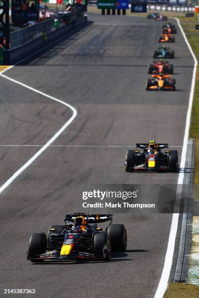 Max Verstappen of the Netherlands driving the Oracle Red Bull Racing RB20 leads Sergio Perez of Mexico driving the Oracle Red Bull Racing RB20 during...