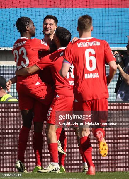 Tim Kleindienst of FC Heidenheim celebrates with Omar Haktab Traore of FC Heidenheim as he scores the goal during the Bundesliga match between 1. FC...