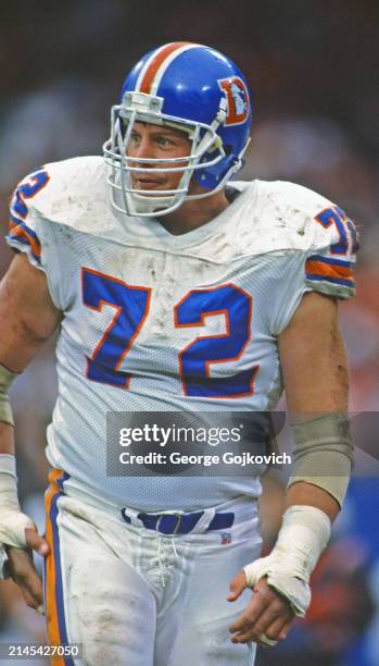 Center Keith Kartz of the Denver Broncos looks on from the field during a game against the Cleveland Browns at Cleveland Municipal Stadium on...