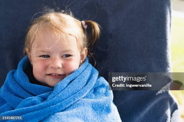cheerful girl wrapped in beach towel - wrapped in a towel stock pictures, royalty-free photos & images