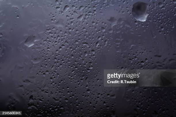 drops of rain on glass raindrops on clear window - best r stock pictures, royalty-free photos & images