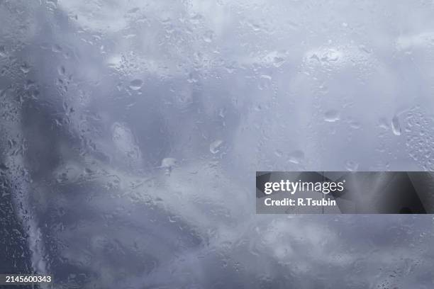 drops of rain on glass raindrops on clear window - best r stock pictures, royalty-free photos & images