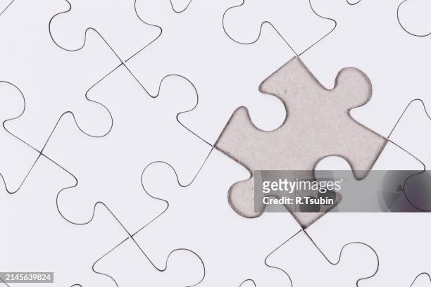 white jigsaw puzzle as a background close up blank empty - best r stock pictures, royalty-free photos & images