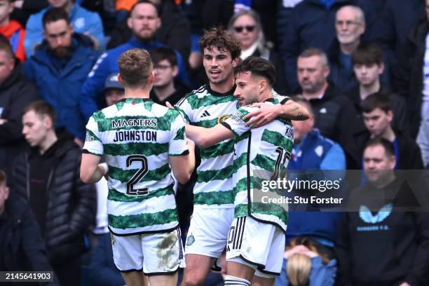 Matt O'Riley of Celtic celebrates scoring his team's second goal with teammates during the Cinch Scottish Premiership match between Rangers FC and...