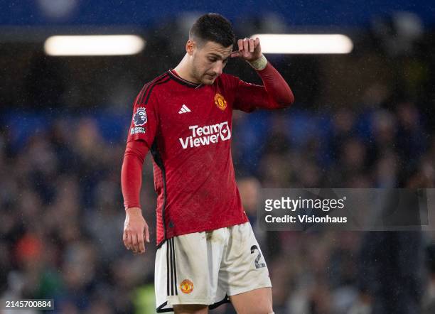 Diogo Dalot of Manchester United reacts to defeat after the Premier League match between Chelsea FC and Manchester United at Stamford Bridge on April...