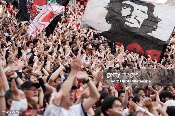 Fans of Urawa Red Diamonds cheer during the J.LEAGUE MEIJI YASUDA J1 7th Sec. Match between Urawa Red Diamonds and Sagan Tosu at Saitama Stadium on...