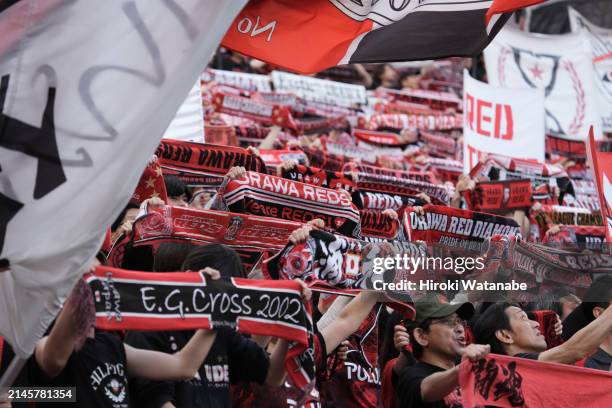 Fans of Urawa Red Diamonds cheer after the J.LEAGUE MEIJI YASUDA J1 7th Sec. Match between Urawa Red Diamonds and Sagan Tosu at Saitama Stadium on...