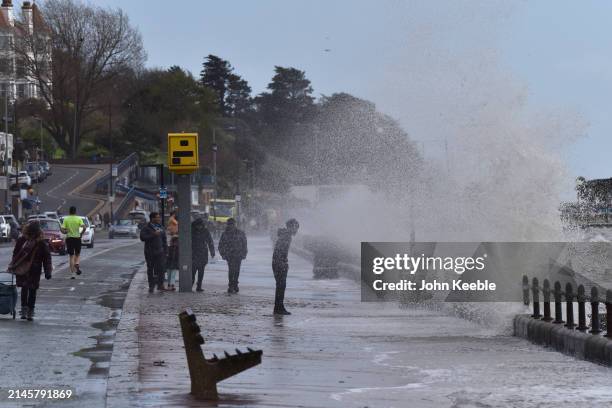 Children play in the spray from waves in windy conditions along the seafront promenade in Westcliff on April 7, 2024 in Southend-on-Sea, United...