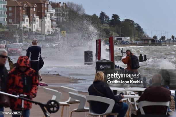 Spray from waves in windy conditions covers the pavement along the seafront promenade in Westcliff on April 7, 2024 in Southend-on-Sea, United...
