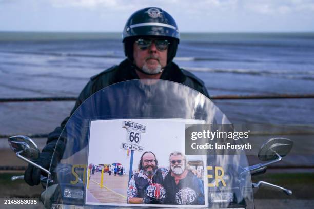 Biker parks his Harley Davidson motorcycle on the seafront as he arrives in Scarborough after completing a memorial bike ride for Dave Myers of the...