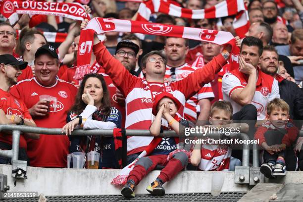 Fans of Düsseldorf react during the Second Bundesliga match between Fortuna Düsseldorf and Eintracht Braunschweig at Merkur Spiel-Arena on April 07,...