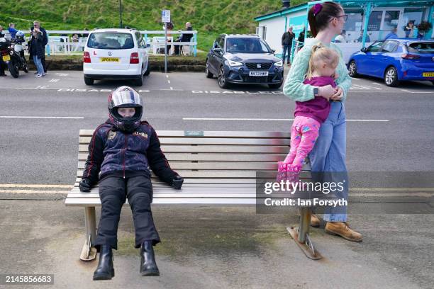 Young passenger from a bike takes a seat on the seafront in Scarborough after completing a memorial bike ride for Dave Myers of the Hairy Bikers on...