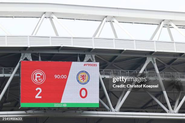 The video screen shows the result of the Second Bundesliga match between Fortuna Düsseldorf and Eintracht Braunschweig at Merkur Spiel-Arena on April...