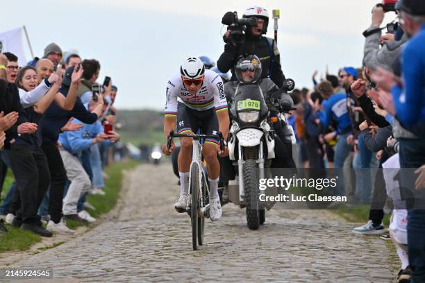 Mathieu van der Poel of The Netherlands and Team Alpecin - Deceuninck competes in the breakaway passing through the Mons-en-Pévèle cobblestones...