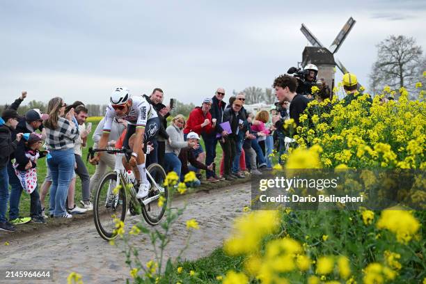 Mathieu van der Poel of The Netherlands and Team Alpecin - Deceuninck competes in the breakaway passing through the Templeuve cobblestones sector...