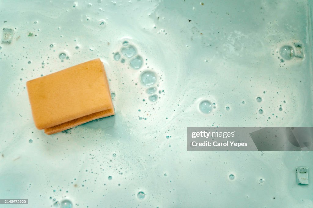 Elevated view of scouring pad on blue background