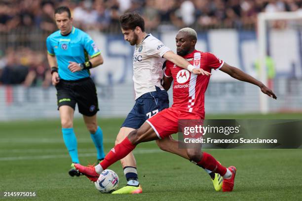 Khvicha Kvaratskhelia of SSC Napoli and Jean-Daniel Akpa Akpro of AC Monza battle for the ball during the Serie A TIM match between AC Monza and SSC...